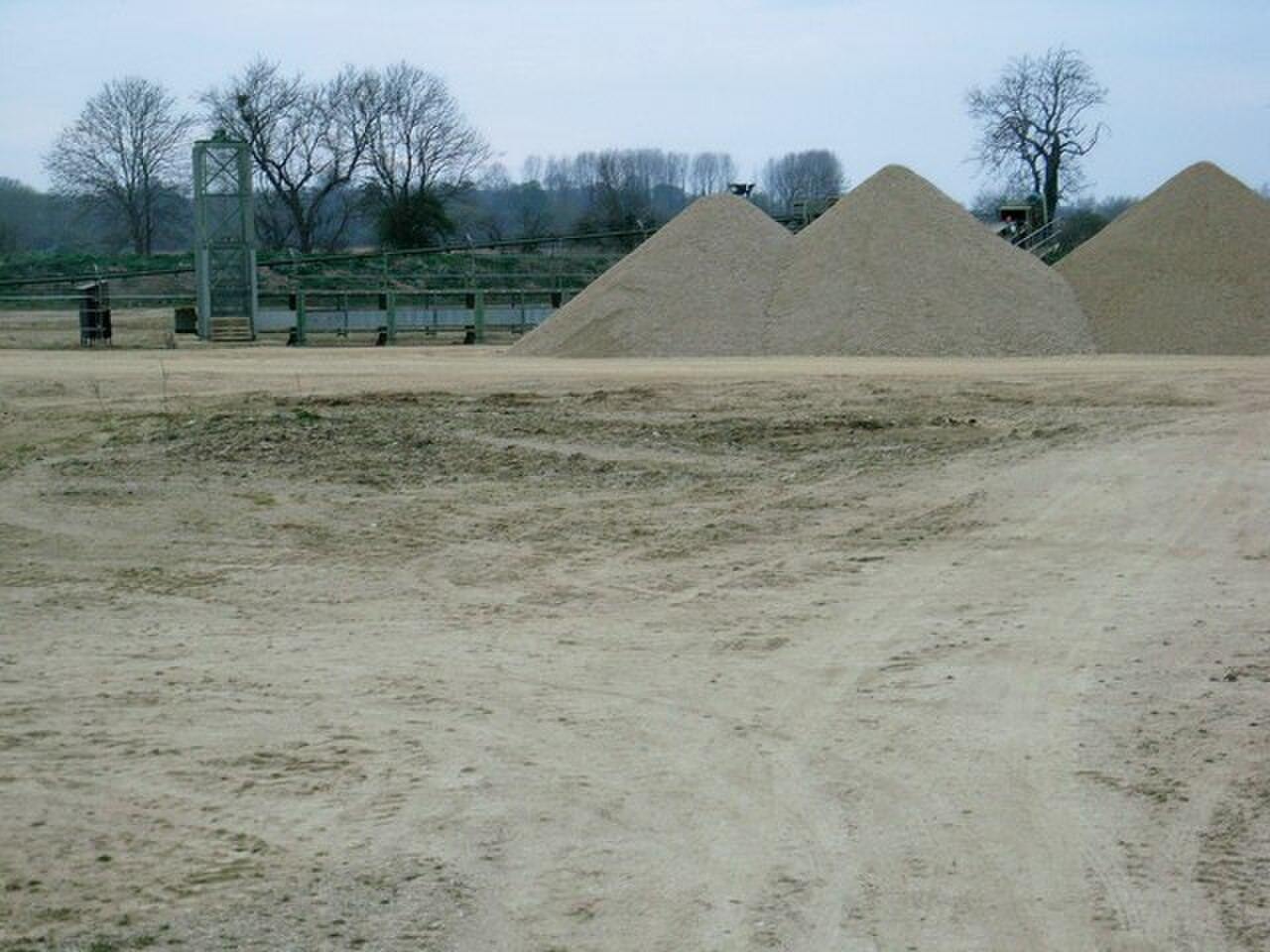 A conveyor feeding stockpiles of aggregate