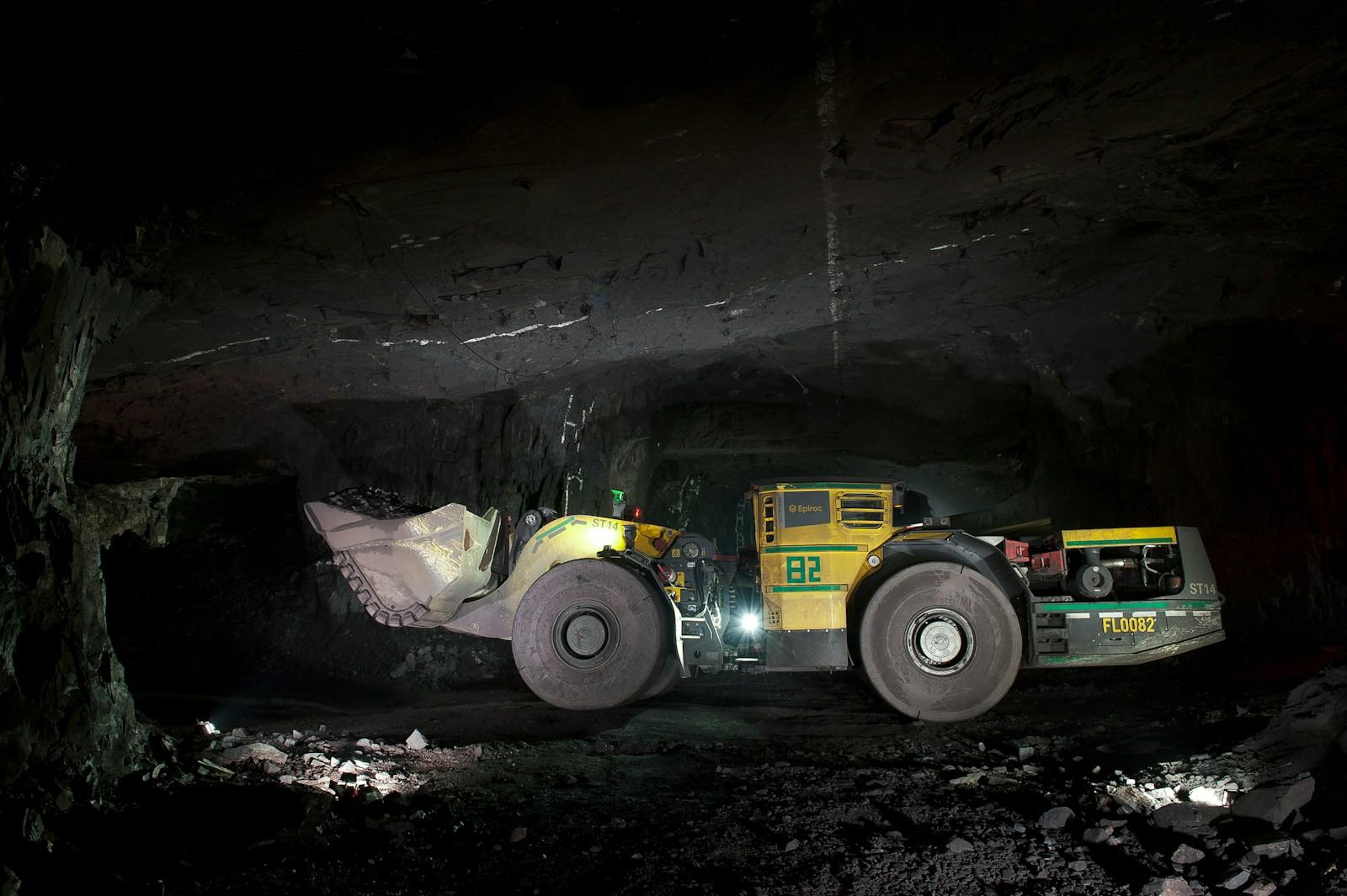 An underground loader working in a mine tunnel