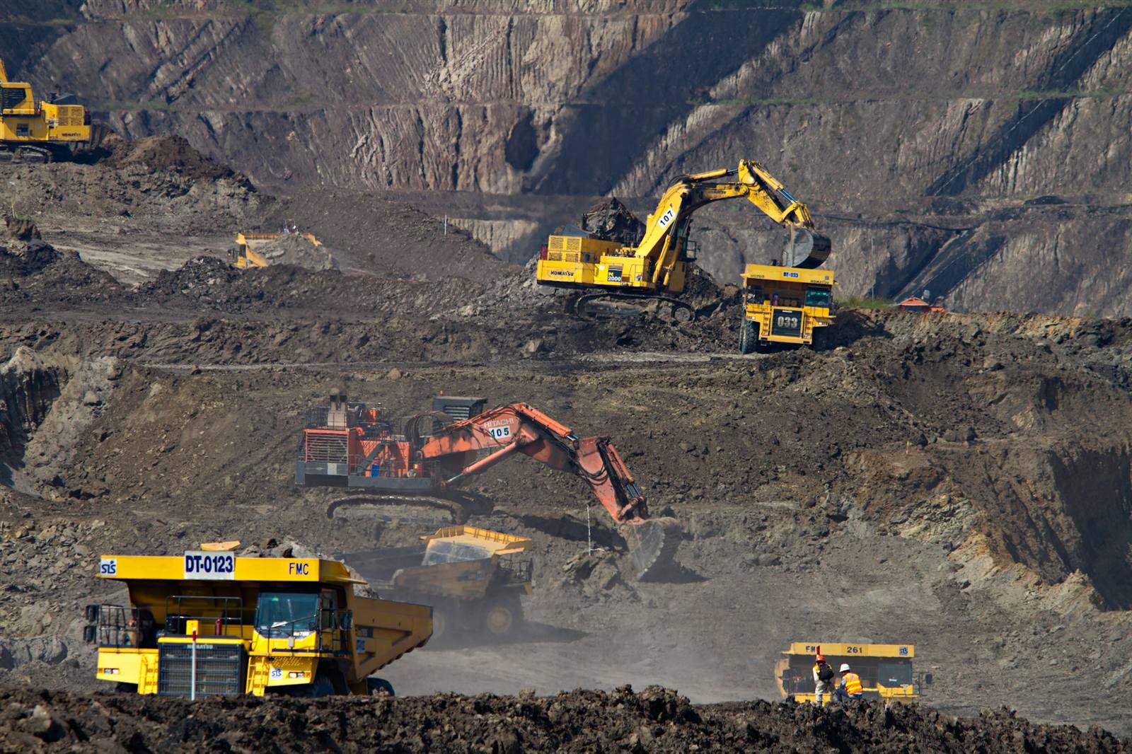 Heavy excavators operating in an open-pit mining area